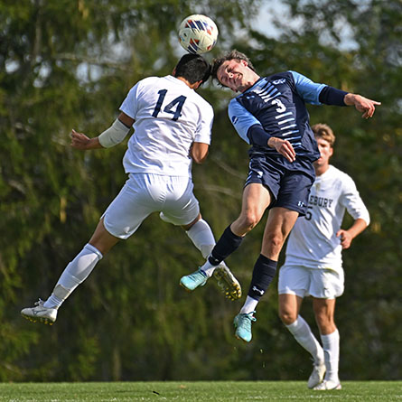 Camel defender Sam Boehm ’24 goes for a header during an Oct. 15 game against Middlebury on Conn’s Freeman Field. 