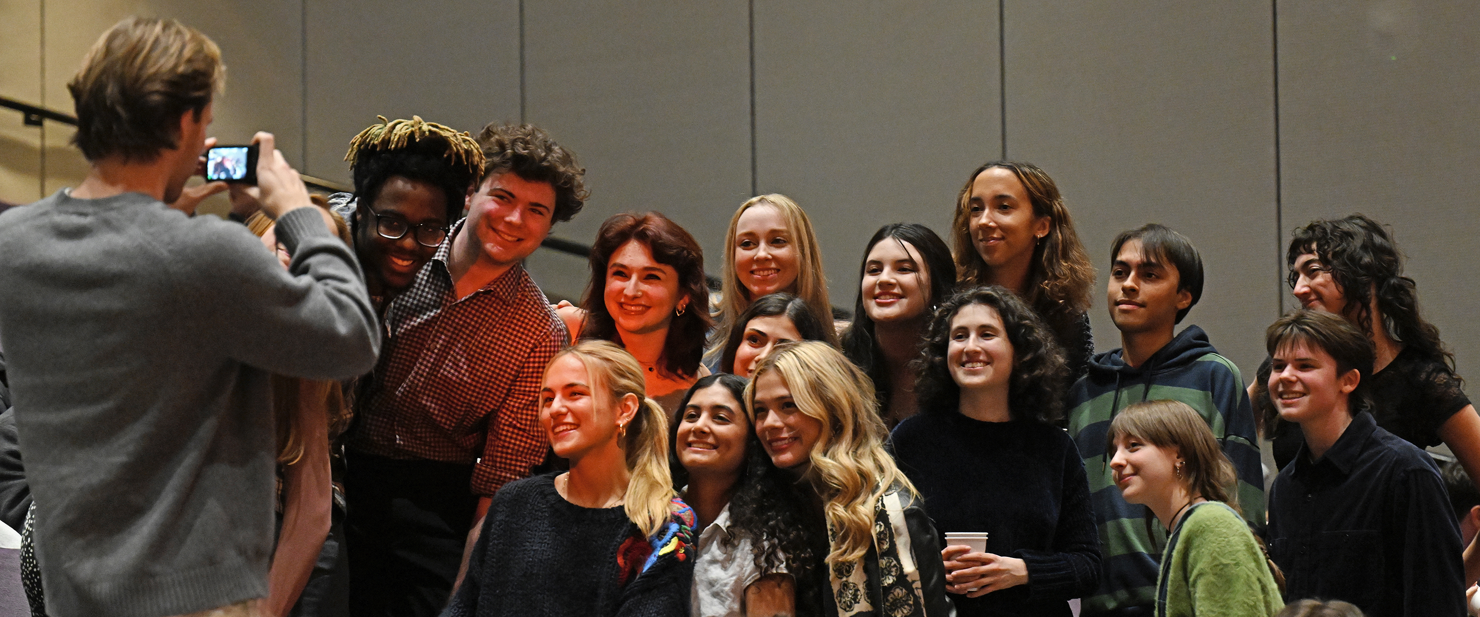 Students pose for a photo before the start of the student film festival..